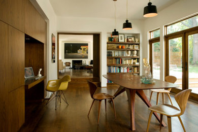 Photo of a large modern separate dining room in Boston with white walls, medium hardwood floors and no fireplace.