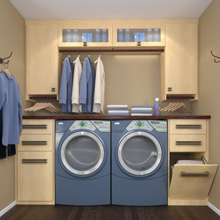 Design ideas for a small contemporary single-wall utility room in Los Angeles with flat-panel cabinets, light wood cabinets, laminate countertops and a side by side washer and dryer.
