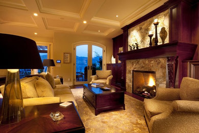 Inspiration for a timeless open concept medium tone wood floor and brown floor living room remodel in Vancouver with beige walls, a standard fireplace, a stone fireplace and no tv