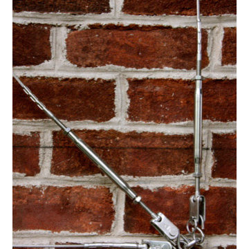 Cable ties on brick, for quince espalier