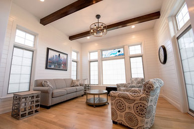 Inspiration for a timeless light wood floor and white floor sunroom remodel in Other