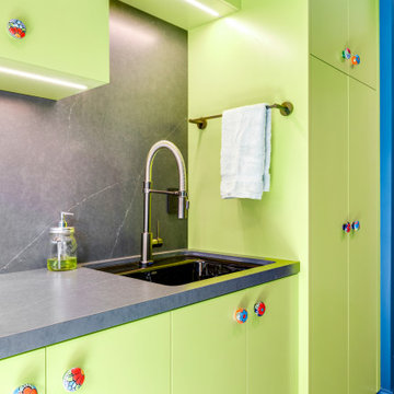 Bold Blue and Green Laundry Room with Matte Charcoal Qaurtz Countertop and Back