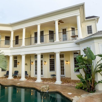 Resort style pool with lake and golf course view.