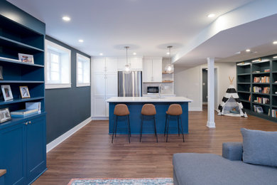 Inspiration for a large transitional look-out vinyl floor and brown floor basement remodel in DC Metro