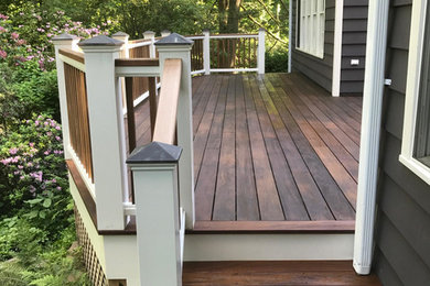 Example of a mid-sized transitional backyard deck design in New York with no cover