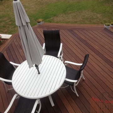 Ipe Hardwood Decking with Metal Framing, Limestone Flower Beds around Deck