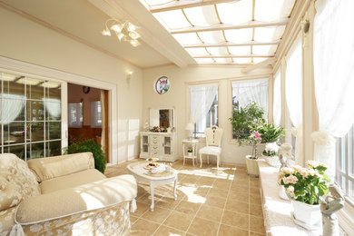 Design ideas for a traditional sunroom in Other with ceramic floors, a skylight and beige floor.