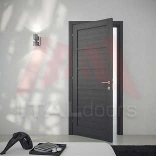 Medium sized modern home studio in Miami with grey walls, no fireplace, porcelain flooring, a freestanding desk and white floors.