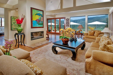 Living room - large eclectic formal and open concept living room idea in San Francisco with beige walls, a two-sided fireplace, a concrete fireplace and no tv