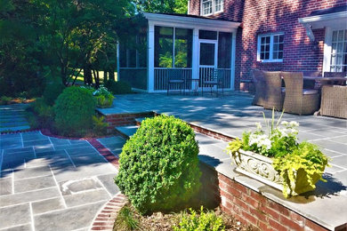Mid-sized elegant backyard stone patio photo in Atlanta with no cover