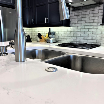Dark Charcoal Blue Painted Kitchen With Bar Height Island