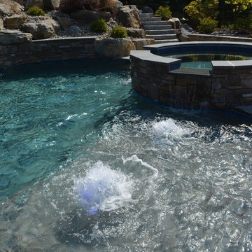 Custom Freeform style salt water in ground pool with Waterslide and Spa