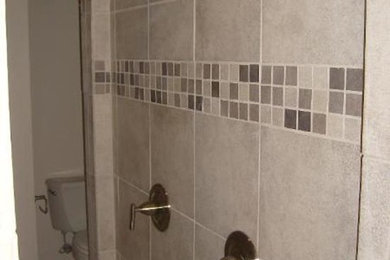 Beige tile alcove shower photo in Dallas