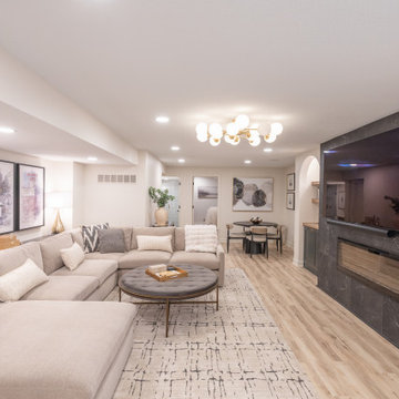 Warm & Inviting Basement Retreat with Custom Bar + Entertainment Center