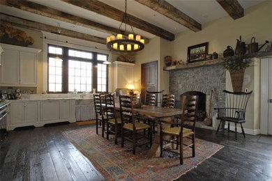 Example of a country medium tone wood floor kitchen/dining room combo design in Nashville