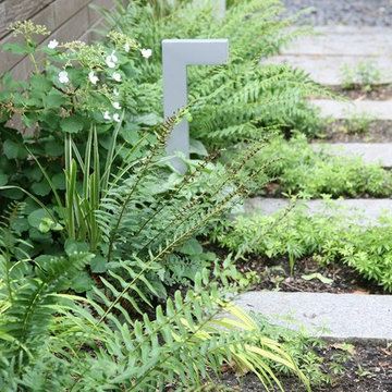 Reclaimed granite curbing path to pergola