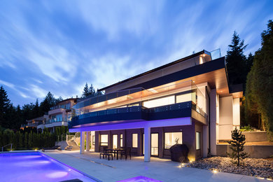 Large trendy beige three-story mixed siding exterior home photo in Vancouver