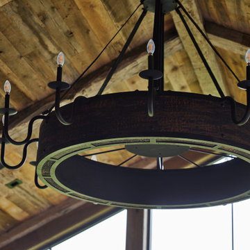 Weathered Antique Paneling and Hand Hewn Timbers on Vaulted Farmhouse Ceiling