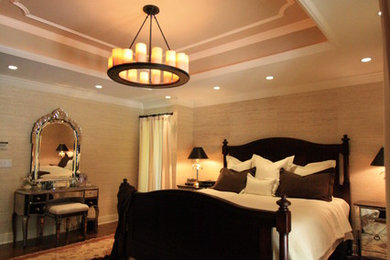 Transitional master dark wood floor bedroom photo in New York with beige walls