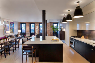 Design ideas for a contemporary open plan kitchen in New York with flat-panel cabinets, black cabinets and brown splashback.