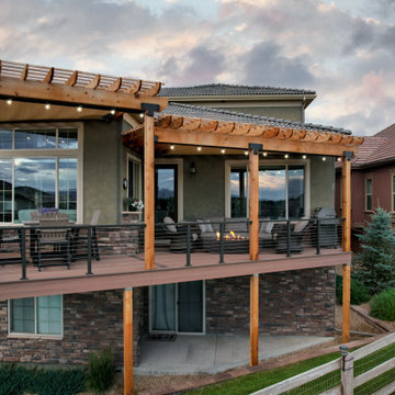 Erie Angular Deck with Expansive Tiered Pergolas and Custom Railing