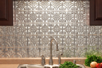 Kitchen - traditional kitchen idea in Other with metallic backsplash