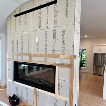 CUSTOM FLOOR-TO-CEILING FIREPLACE WITH MITERED RETURNS
