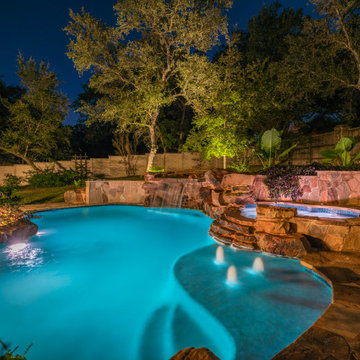 Freeform Pool with Negative Edge, Grotto, and Spa