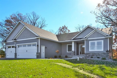 Inspiration for a gray one-story vinyl house exterior remodel in Minneapolis