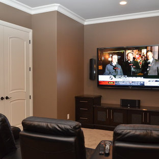 Trendy home theater photo in Edmonton with brown walls and a wall-mounted tv