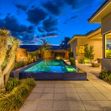 Raised Rim Flow Pool with Custom Fire/Water Feature