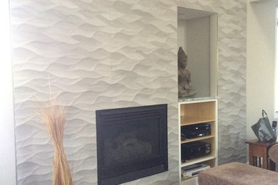 Example of a mid-sized trendy dark wood floor family room design in Denver with a standard fireplace and a tile fireplace