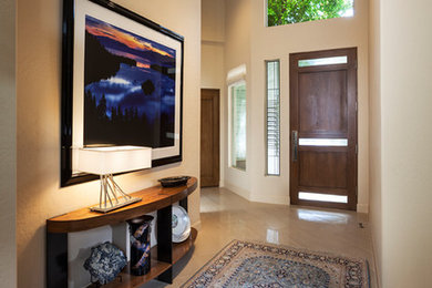 Inspiration for a mid-sized transitional foyer in Phoenix with beige walls, porcelain floors, a single front door, a dark wood front door and beige floor.