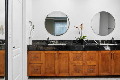 Bathroom - large transitional master green tile and porcelain tile porcelain tile, green floor and double-sink bathroom idea in Other with shaker cabinets, medium tone wood cabinets, a two-piece toilet, white walls, an undermount sink, quartzite countertops, black countertops and a built-in vanity