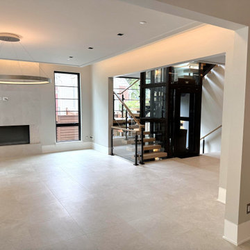 Project #136 | Modern Floating Staircase Encircling Glass Elevator