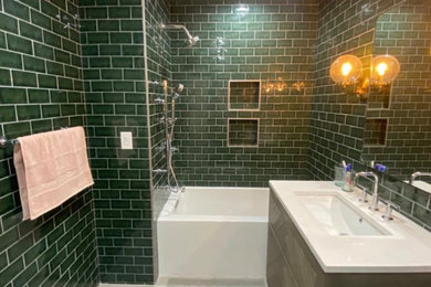 Alcove bathtub - large modern master green tile and porcelain tile single-sink alcove bathtub idea in New York with flat-panel cabinets, brown cabinets, a two-piece toilet, green walls, an undermount sink, marble countertops, white countertops and a freestanding vanity