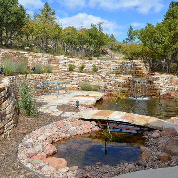 Three level of ponds with falls, bridge, and fish