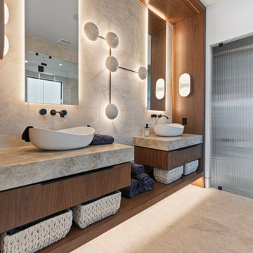 Modern Luxury Lakehouse Double Vanity Bathroom with Stone Countertops and Backli