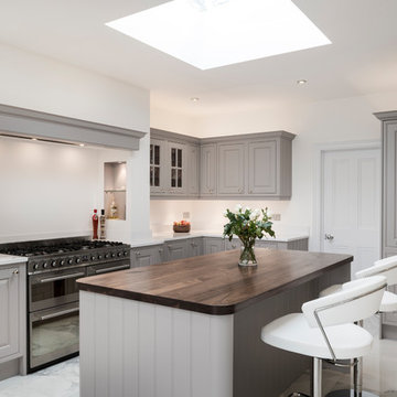Upcycled grey kitchen with quartz and walnut surfaces