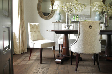 Photo of a mid-sized traditional dining room in Manchester with white walls and dark hardwood floors.