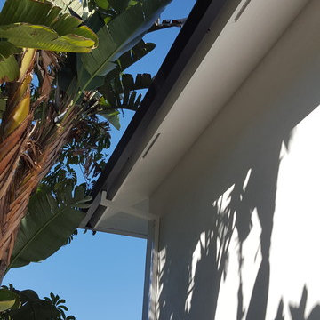 Huntington Beach California, White Fascia Wrap, Black 6 inch Angle Face Gutters