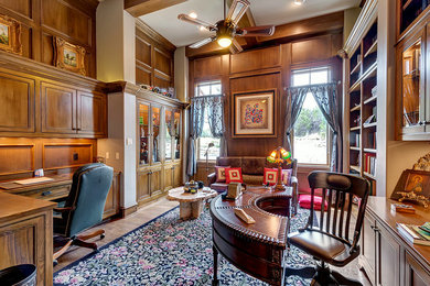 Study room - huge traditional freestanding desk medium tone wood floor and brown floor study room idea in Dallas with beige walls