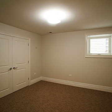 Cozy Carpeted Room with Beige Walls and Small Window