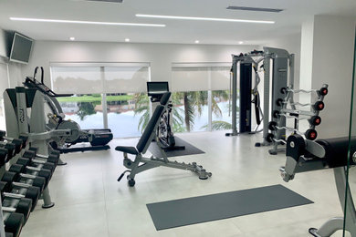 Indoor basketball/tennis/multi-game court - mid-sized contemporary gray floor indoor basketball/tennis/multi-game court idea in Miami with white walls