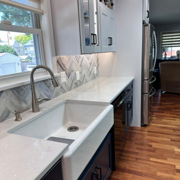 Blue base cabinets with farm sink