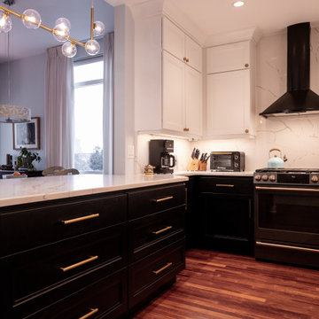 Black Shaker Cabinetry & Quartz Peninsula beside the Kitchen Window