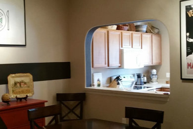 Inspiration for a small transitional porcelain tile and white floor dining room remodel in Tampa with beige walls