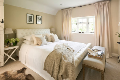 Design ideas for a small traditional master bedroom in Hertfordshire with beige walls, carpet, no fireplace and beige floor.