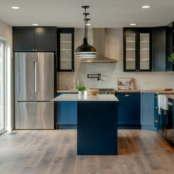 Modern Farmhouse Kitchen with Navy Cabinetry and Open-Concept Layout