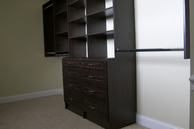 Example of a minimalist closet design in Other